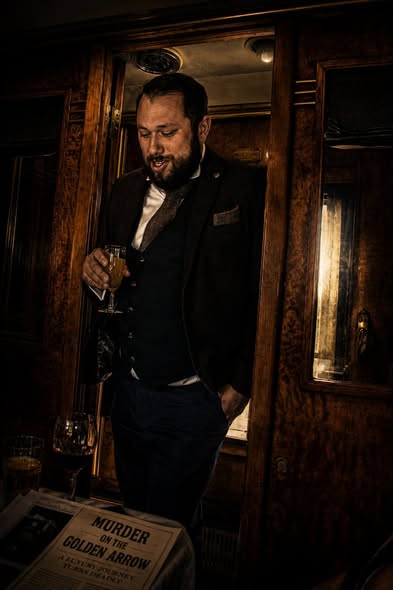 An actor in character aboard the Pullman carriage